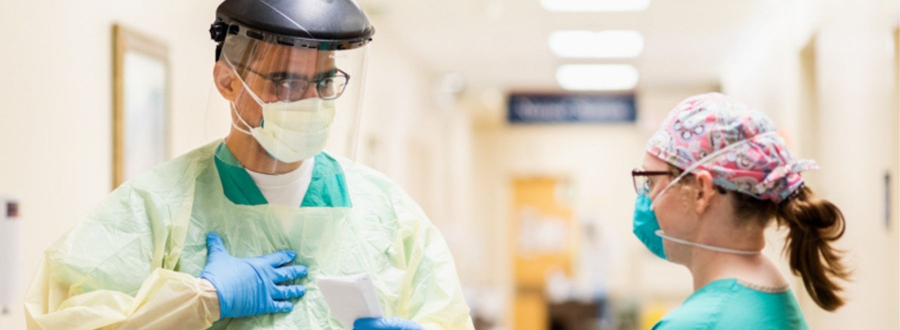 Two hospital medicine physicians in PPE.